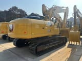 2026 Caterpillar 323GX crawler excavator rear three-quarter view