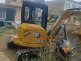 2021 Caterpillar 303.5E mini excavator, rear three-quarter view