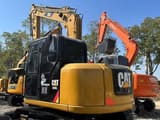 2025 Caterpillar 308E Mini Excavator rear three-quarter view