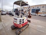 2019 Takeuchi TB215R mini excavator, rear three-quarter view