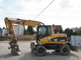 Pelle sur roues Caterpillar M313C de 2003