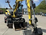 2023 Wacker Neuson EW100 wheel excavator, front three-quarter view