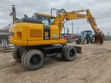 2007 Komatsu PW140-7 wheel excavator, rear three-quarter view