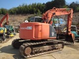 2004 Hitachi ZX135USK crawler excavator, rear three-quarter view
