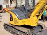 Komatsu PC55MR-2 mini excavator, rear three-quarter view
