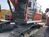 Doosan DX300 crawler excavator, side view of the cab and tracks