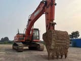 2023 Doosan DX380LC-9C excavator, front three-quarter view