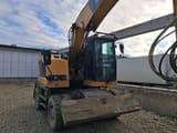 2021 Caterpillar M315F wheel excavator, front three-quarter view