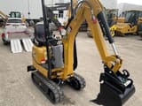 2021 Caterpillar 300.9D mini excavator, side view