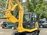 2022 Komatsu PC56-7 mini excavator, front three-quarter view