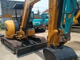 2024 Caterpillar 304C mini excavator, front three-quarter view
