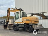 2004 Liebherr A312 wheel excavator, rear three-quarter view