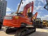 2023 Doosan DX225LCA crawler excavator, rear three-quarter view