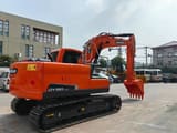 2022 Doosan DX150-9C mini excavator, rear three-quarter view