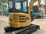 2023 Caterpillar 303CR mini excavator rear three-quarter view