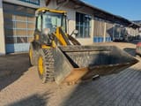 2011 JCB 409 wheel loader, front three-quarter view