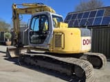 2006 New Holland E135SR-1E crawler excavator, rear three-quarter view