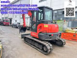2023 Kubota KX057-4 mini excavator, rear three-quarter view