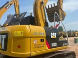 2024 Caterpillar 312D mini excavator, rear three-quarter view