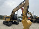 2023 Caterpillar 320GC crawler excavator, rear three-quarter view