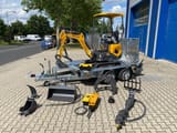 Berger Kraus BK1000JSR mini excavator on trailer with attachments