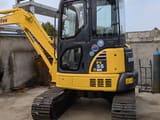 2023 Komatsu PC-55MR mini excavator, rear three-quarter view