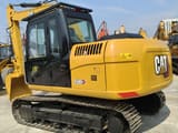 2022 Caterpillar 312D2 GC crawler excavator rear three-quarter view