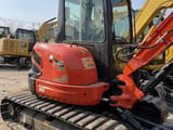 2026 Kubota U40-3 mini excavator, side profile view