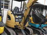 2023 Caterpillar 302CR mini excavator, front three-quarter view