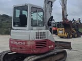 2007 Takeuchi TB153 mini excavator, rear three-quarter view