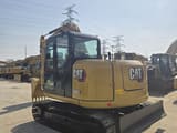 2023 Caterpillar 308E2 mini excavator, rear three-quarter view