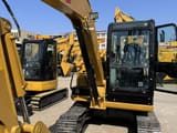 2024 Caterpillar 303.5 mini excavator, front three-quarter view
