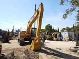 2024 Caterpillar 320B crawler excavator, front three-quarter view