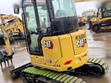 2025 Caterpillar 303CR mini excavator, rear three-quarter view