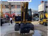 2023 Caterpillar 307.5 crawler excavator, rear view