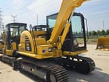 2024 Komatsu PC70-8 mini excavator, rear three-quarter view