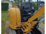 2020 Caterpillar 303.5E CR crawler excavator, rear three-quarter view