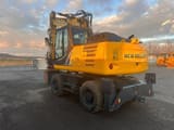2013 New Holland WE170B wheel excavator, rear three-quarter view