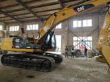 Caterpillar 325DL crawler excavator, side view