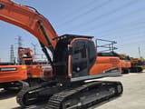 2023 Doosan DX300LC excavator, front three-quarter view