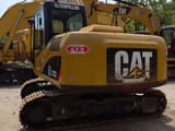 2022 Caterpillar 312D excavator rear three-quarter view