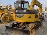 2023 Komatsu PC78US excavator, rear three-quarter view