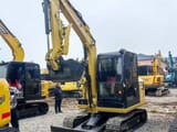 2024 Caterpillar 306E2 mini excavator, front three-quarter view