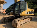2009 Caterpillar 325CL crawler excavator, front three-quarter view