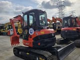 2023 Kubota U55-4 mini excavator, front three-quarter view