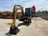 2024 Caterpillar 306E mini excavator, front three-quarter view