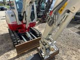 2025 Takeuchi TB230 V3 mini excavator, front three-quarter view