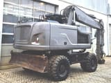 2020 Caterpillar M320F wheel excavator rear three-quarter view