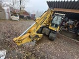 2014 Komatsu PW148-8 wheel excavator, front three-quarter view