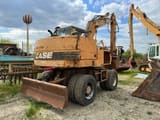 1997 CASE 588-P wheel excavator, rear three-quarter view